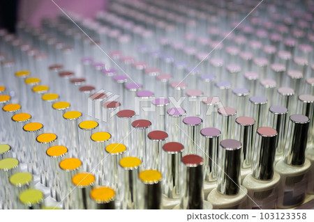 Set of colorful nail varnishes in row on counter of cosmetic shop Set of colorful nail varnishes in row on counter of cosmetic shop 103123358