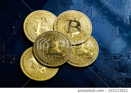 Bitcoin golden coin as a group on computer circuit board. Electrical circuit blue background, Finance And Investment Concept. 103123821