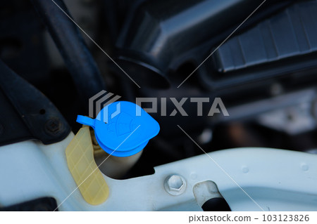 Wiper tank in engine room for check water level for Clean the windshield. Car Repairs, vehicle maintenance, car mechanic, Car inspection and maintenance concept. Wiper tank in engine room for check water level for Clean the windshield. Car Repairs, vehicle maintenance, car mechanic, Car inspection and maintenance concept. 103123826