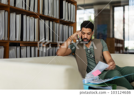 Young man sitting in office and working. 103124686