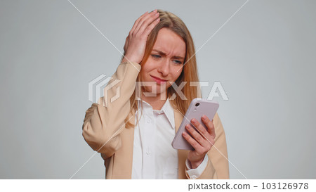 Woman use smartphone typing browsing loses becoming surprised sudden lottery results bad fortune Woman use smartphone typing browsing loses becoming surprised sudden lottery results bad fortune 103126978