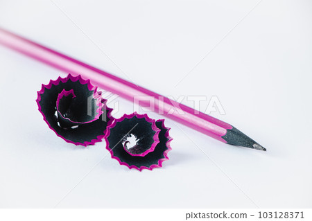 Wooden purple pencil and shavings on white background. Wooden purple pencil and shavings on white background. 103128371