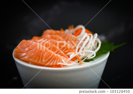 fresh raw salmon fish for cooking food seafood salmon fish, salmon sashimi food salmon fillet japanese menu with shiso perilla leaf lemon herb and spices 103128450