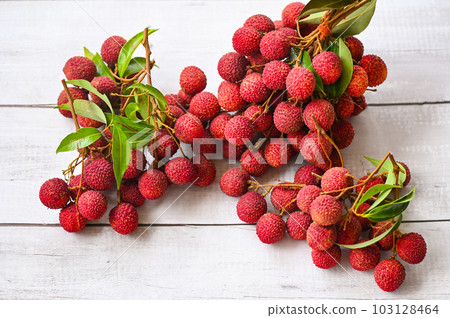 lychees on background, fresh ripe lychee fruit tropical fruit lychees in Thailand - top view 103128464