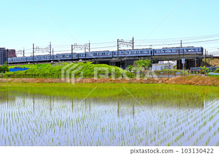 A silver train running through the countryside Tobu Isesaki Line A silver train running through the countryside Tobu Isesaki Line 103130422