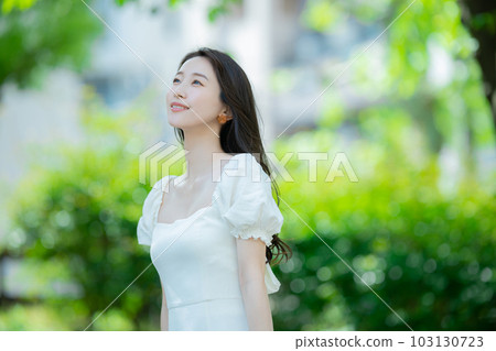 Woman with long hair outdoors Woman with long hair outdoors 103130723