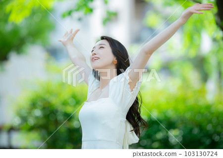 Woman with long hair outdoors Woman with long hair outdoors 103130724