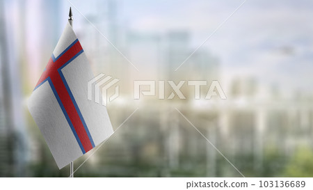 Small flags of the Faroe Islands on an abstract blurry background Small flags of the Faroe Islands on an abstract blurry background 103136689