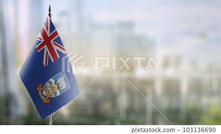 A small Falkland Islands flag on an abstract blurry background 103136690