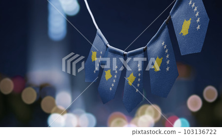 A garland of Kosovo national flags on an abstract blurred background A garland of Kosovo national flags on an abstract blurred background 103136722
