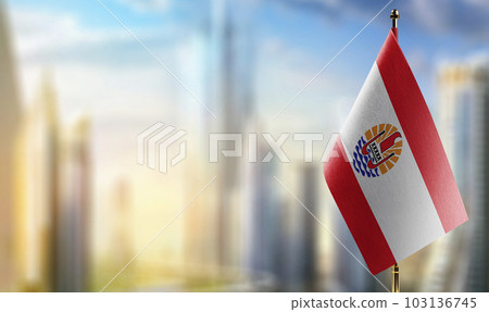 A small French Polynesia flag on an abstract blurry background A small French Polynesia flag on an abstract blurry background 103136745