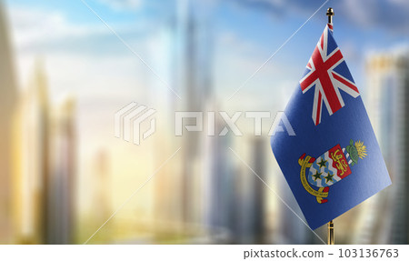 Small flags of the Cayman Islands on an abstract blurry background Small flags of the Cayman Islands on an abstract blurry background 103136763