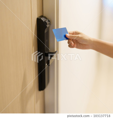 Hand using keycard for smart digital door lock while open or close the door at home or apartment. NFC Technology, Fingerprint scan, PIN number, smartphone and contactless lifestyle concepts Hand using keycard for smart digital door lock while open or close the door at home or apartment. NFC Technology, Fingerprint scan, PIN number, smartphone and contactless lifestyle concepts 103137718