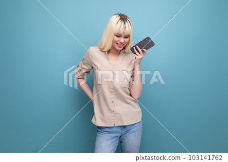 close-up photo of a charming european blonde woman chatting on the phone 103141762