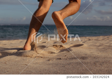 close-up. feet in the sand. run close-up. feet in the sand. run 103142024