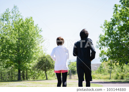Young couple running in the park Young couple running in the park 103144880