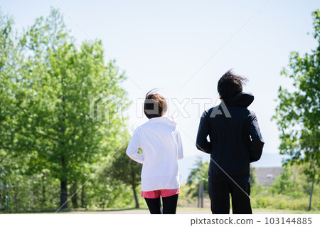Young couple running in the park Young couple running in the park 103144885