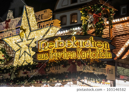 Koblenz Germany 17.12.2022 imbiss selling food potato pancakes from fresh potatos Traditional Christmas market booth Koblenz Germany 17.12.2022 imbiss selling food potato pancakes from fresh potatos Traditional Christmas market booth 103146582