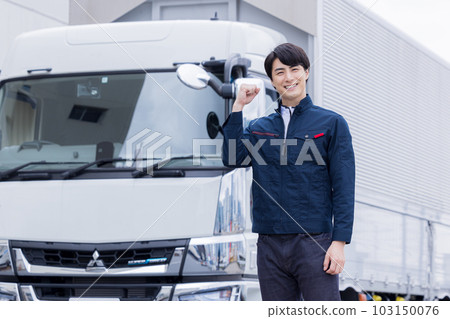 A smiling truck driver doing a guts pose A smiling truck driver doing a guts pose 103150076