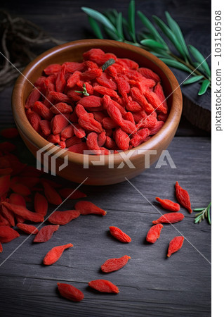 Goji berry on a wooden background Goji berry on a wooden background 103150508
