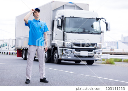 Driver standing in front of the truck Driver standing in front of the truck 103151233
