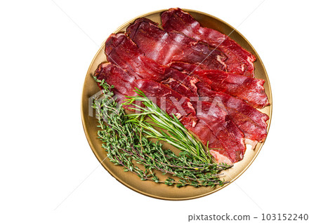 Basturma, sliced dried beef meat, meat Jerky in steel plate with herbs and spices. Isolated on white background. 103152240
