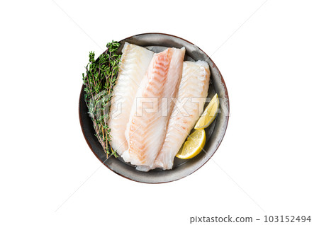 Fresh raw cod fish fillets with herbs served on steel tray. Isolated on white background. Fresh raw cod fish fillets with herbs served on steel tray. Isolated on white background. 103152494