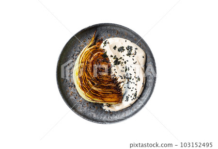 Grilled cabbage steaks with spices on a gray plate, healthy vegan food. Isolated on white background. Grilled cabbage steaks with spices on a gray plate, healthy vegan food. Isolated on white background. 103152495