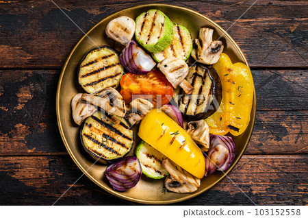 Various grilled Vegetables, bell pepper, zucchini, eggplant, onion and tomato. Wooden background. Top view 103152558