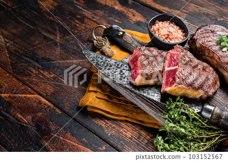 Oyster Top Blade beef meat steak grilled on summer BBQ. Wooden background. Top View. Copy space 103152567