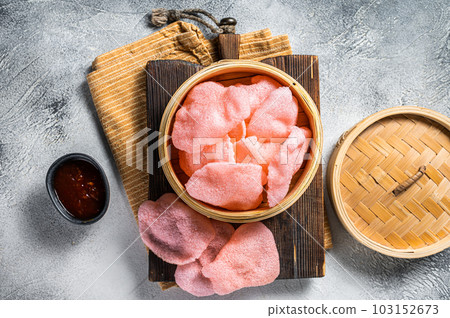 Indonesian prawn shrimp crackers or chips with sauce. White background. Top view Indonesian prawn shrimp crackers or chips with sauce. White background. Top view 103152673