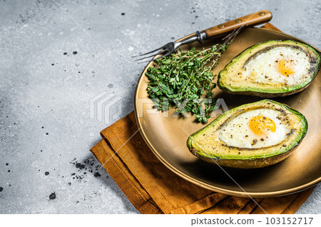 Brunch with Baked Avocado and Egg. Gray background. Top view. Copy space 103152717