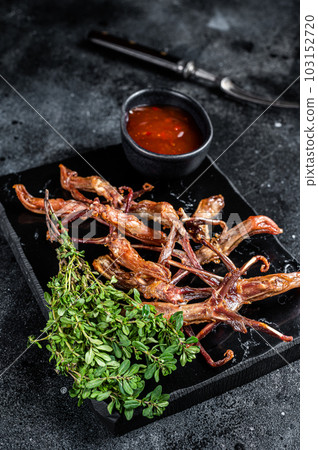 Chinese food dip fried duck tongue Black background. Top view Chinese food dip fried duck tongue Black background. Top view 103152720
