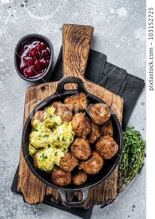 Swedish Meatballs with Cream Sauce in a skillet. Gray background. Top view Swedish Meatballs with Cream Sauce in a skillet. Gray background. Top view 103152725
