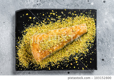 Turkish Dessert Havuc Dilim Baklava with pistachio and honey. Gray background. Top view 103152800