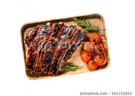 Delicious barbecued ribs seasoned with a spicy basting sauce and served with baked tomatoes. Isolated on white background. 103152852
