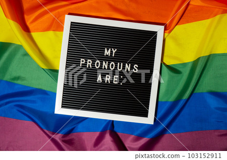 MY PRONOUNS ARE text Neo pronouns concept on Rainbow flag background gender pronouns. Non-binary people rights transgenders. Lgbtq community support assume my gender tolerance equal rights 103152911