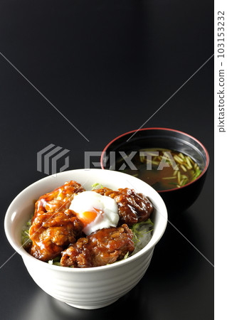 Deep-fried chicken rice topped with soft-boiled egg and miso soup with mitsuba and wakame seaweed Deep-fried chicken rice topped with soft-boiled egg and miso soup with mitsuba and wakame seaweed 103153232