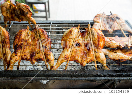 Top view of Roasted chicken leg on a white background, focus selective Top view of Roasted chicken leg on a white background, focus selective 103154539