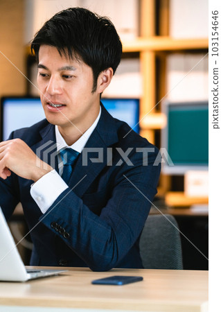 businessman thinking at computer businessman thinking at computer 103154646