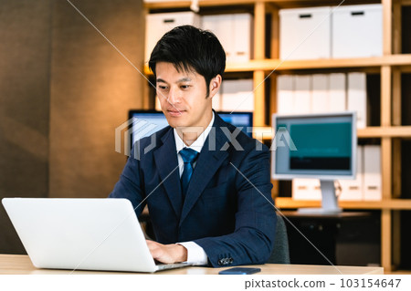businessman thinking at computer 103154647