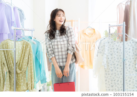 young woman shopping in a store young woman shopping in a store 103155154