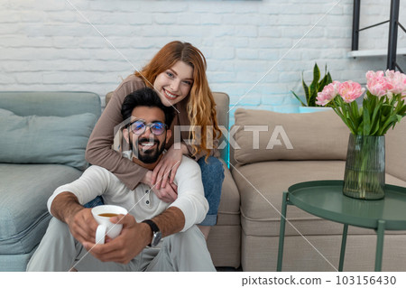 Married couple drinking coffeee, enjoying spending time together, relaxing, sweet tender moment. Married couple drinking coffeee, enjoying spending time together, relaxing, sweet tender moment. 103156430