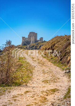 Rocca Calascio ruins dirt road hike trail in Abruzzo region - Italy - Gran Sasso National Park Rocca Calascio ruins dirt road hike trail in Abruzzo region - Italy - Gran Sasso National Park 103157251