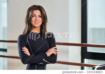 beautiful young girl fitness instructor 103158063