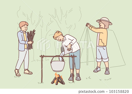 Child scouts take part in hike in forest, putting up tent and building fire to cook dinner 103158820