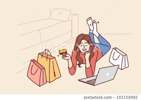 Woman with credit card and laptop after internet shopping or ordering goods on website store 103158992