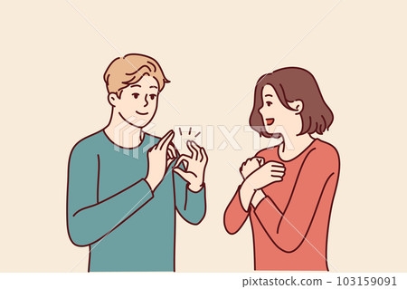 Deaf-mute man and woman are talking using sign language and demonstrating symbols with hands Deaf-mute man and woman are talking using sign language and demonstrating symbols with hands 103159091