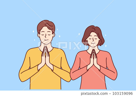 Praying man and woman fold palms in front of chests for joint prayer and religious ritual Praying man and woman fold palms in front of chests for joint prayer and religious ritual 103159096