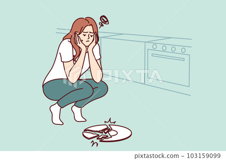 Sad woman broke plate in kitchen and is sad because of favorite saucer given by friends 103159099